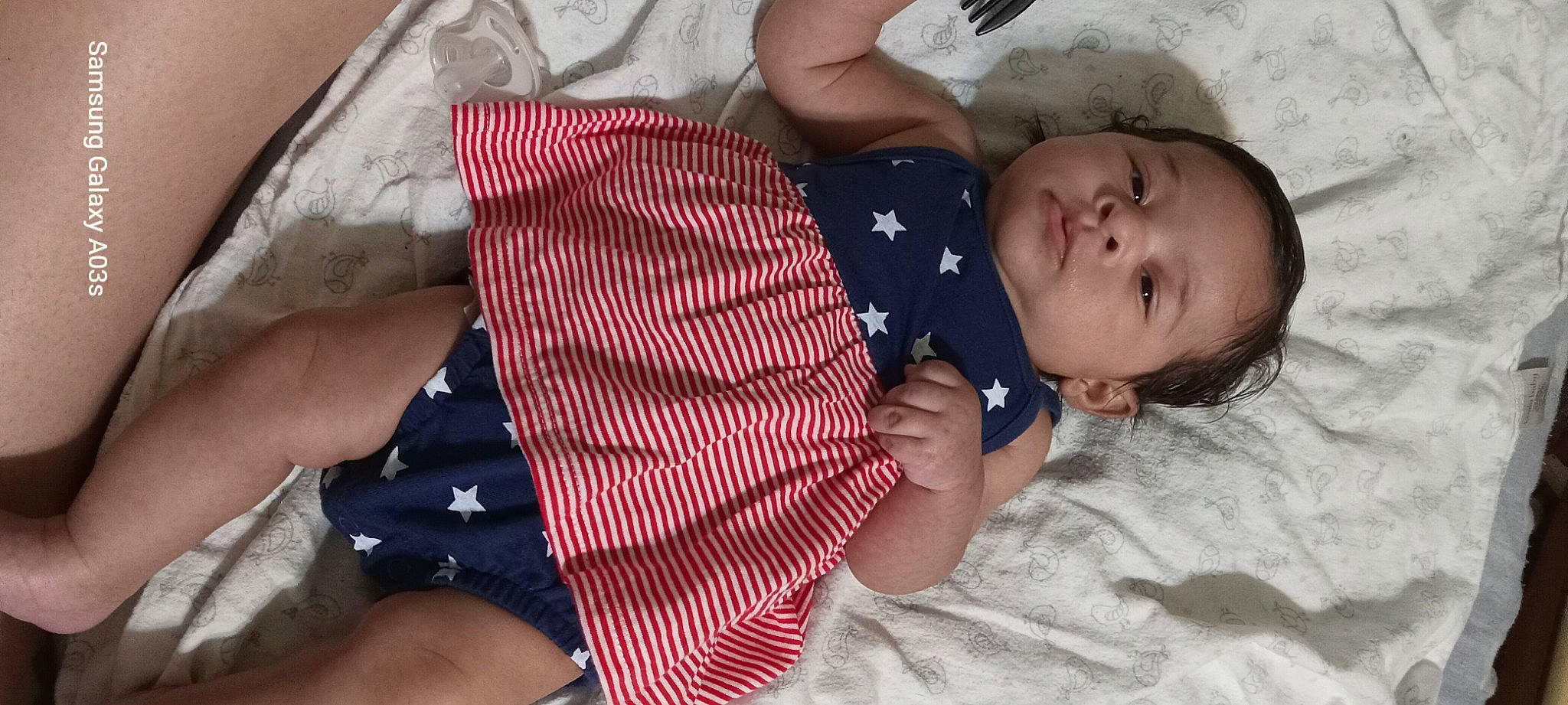 Kaia is registered to the contest to win money with this photo: abdomen, baby, baby_toddler_clothing, bedtime, cheek, chest, child, comfort, finger, human_leg, linens, mouth, pattern, person, product, skin, sleeve, thigh, toddler, tree