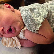 Esmeray is registered to the contest to win money with this photo: baby, blanket, child, closeup, clothing, cozy, cute, face, hand, head, infant, mitten, newborn, peaceful, person, portrait, resting, skin, sleeping, soft