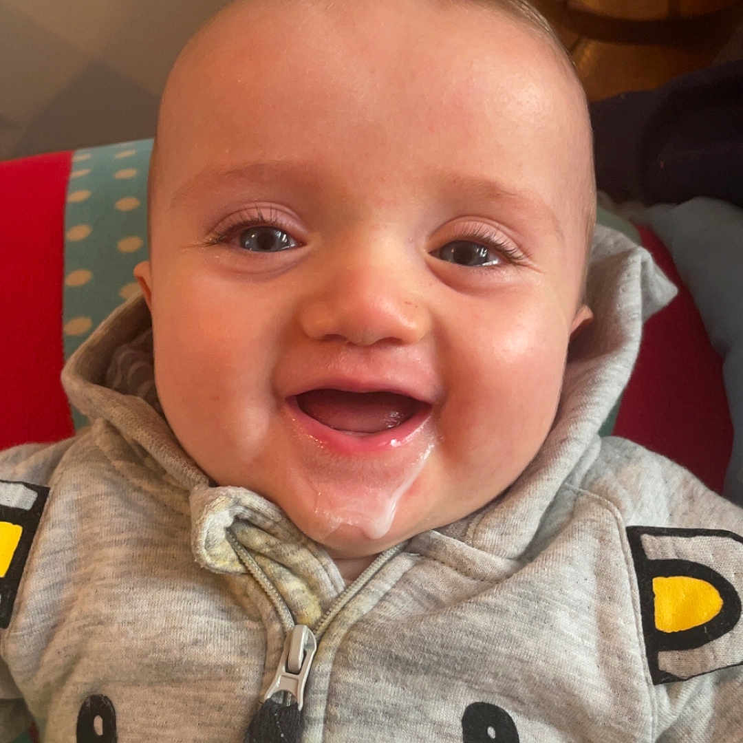 Lucas a rejoint le concours — aidez-le/la à gagner de superbes lots ! baby, bodypart, clothing, coat, face, fleece, happy, hat, head, hood, hoodie, jacket, knitwear, pants, person, photography, portrait, smile, sweater, sweatshirt