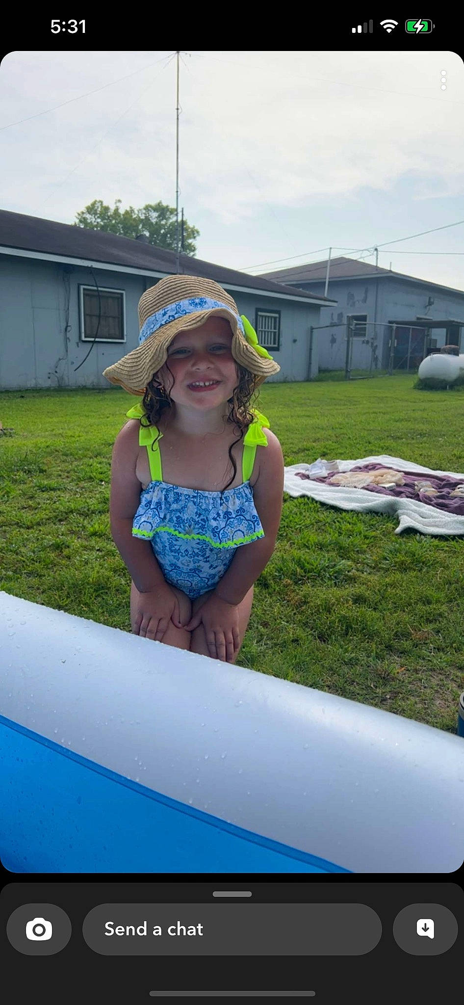Willow is registered to the contest to win money with this photo: automotive_exterior, boats_and_boating_equipment_and_supplies, child, electric_blue, fun, grass, happy, hat, headwear, joy, landscape, leisure, person, plant, recreation, sky, smile, summer, sun_hat, t_shirt