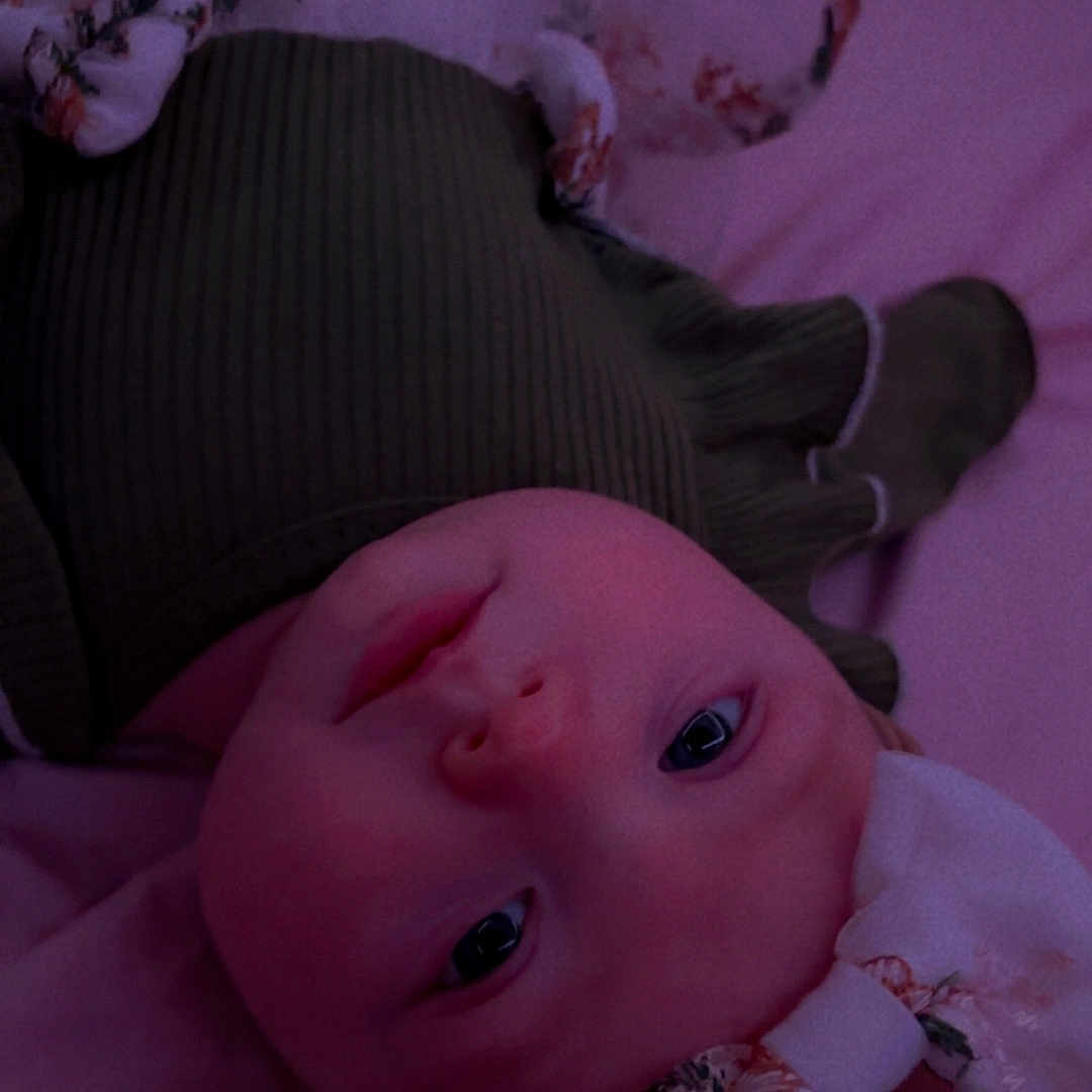 Iris joined the competition — help win amazing prizes! applique, baby, beanie, bed, blanket, bodypart, bonnet, cap, clothing, couch, face, finger, furniture, hand, hat, head, newborn, person, photography, portrait