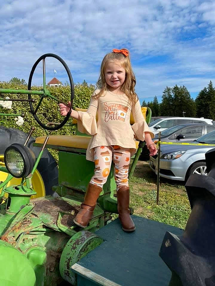 Miabella joined the competition — help win amazing prizes! automotive_design, automotive_exterior, automotive_tire, automotive_wheel_system, bumper, car, cloud, grass, joy, leisure, motor_vehicle, person, plant, shorts, sky, t_shirt, tire, toddler, tractor, vehicle