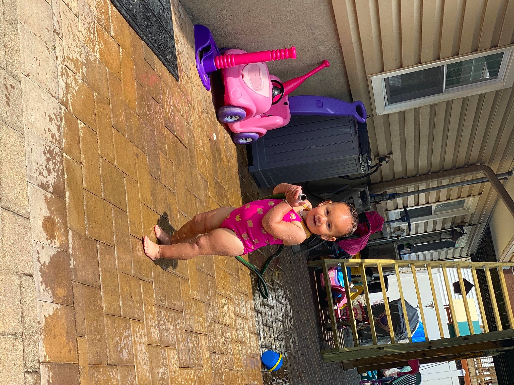 Hazelee is registered to the contest to win money with this photo: art, brick, child, city, fun, human_leg, leg, leisure, magenta, person, pink, purple, sandal, sneakers, street, street_fashion, t_shirt, thigh, tire, toddler