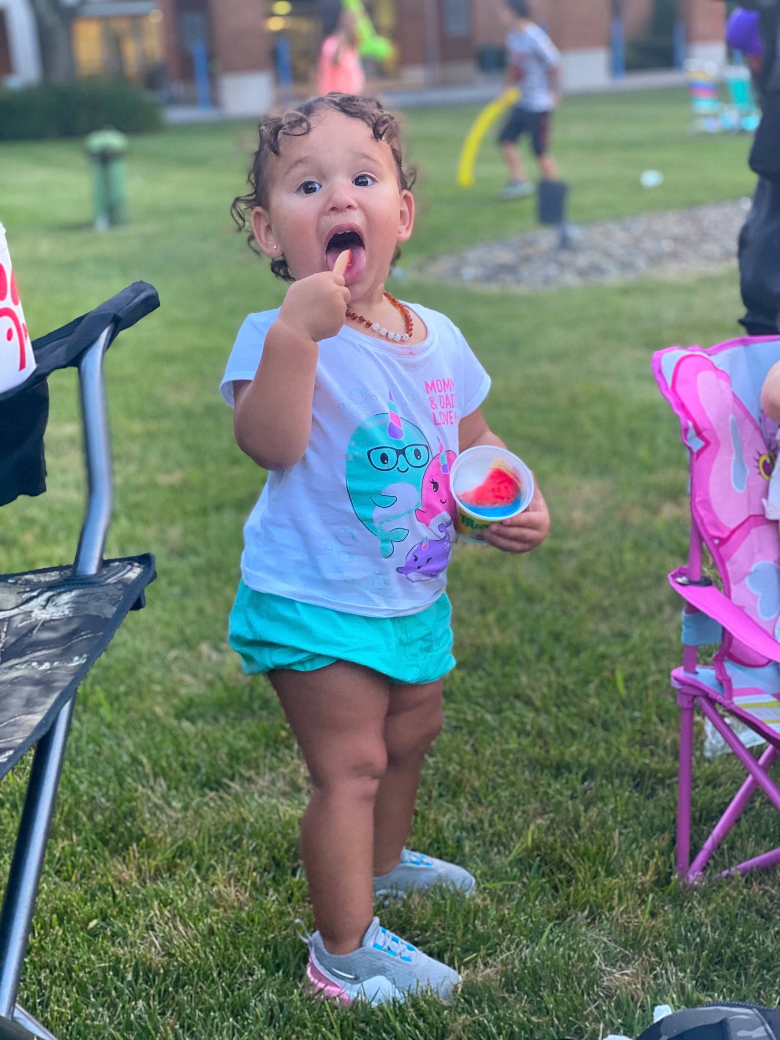 Hazelee joined the competition — help win amazing prizes! chair, child, competition_event, event, flag, folding_chair, fun, grass, happy, lawn, leisure, magenta, outdoor_recreation, person, pink, public_space, recreation, shorts, spring, summer
