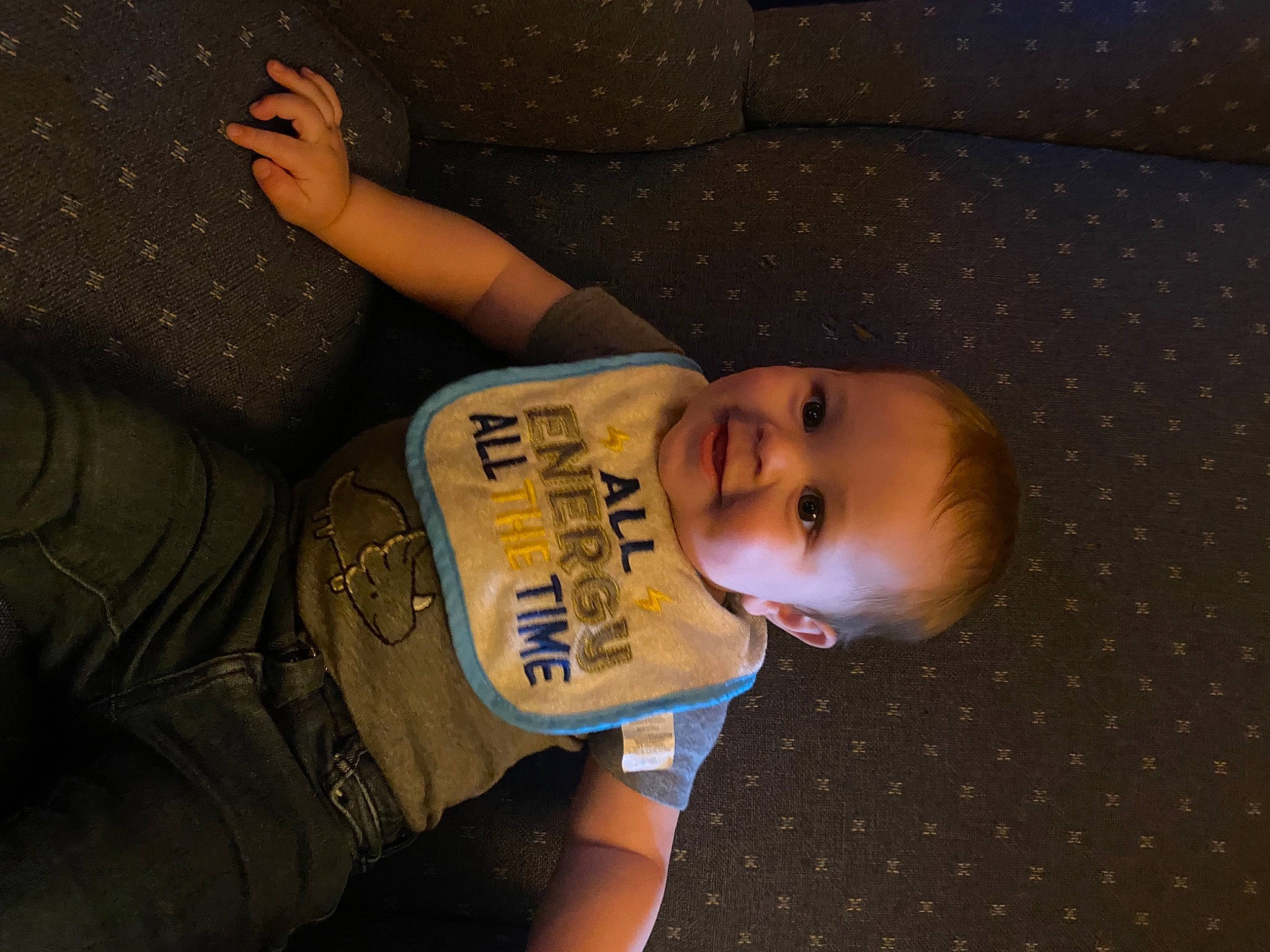 Maddox is registered to the contest to win money with this photo: baby_toddler_clothing, brown, cheek, chin, elbow, electric_blue, finger, flash_photography, flooring, fun, gesture, hairstyle, happy, joy, mouth, pattern, person, sleeve, smile, space