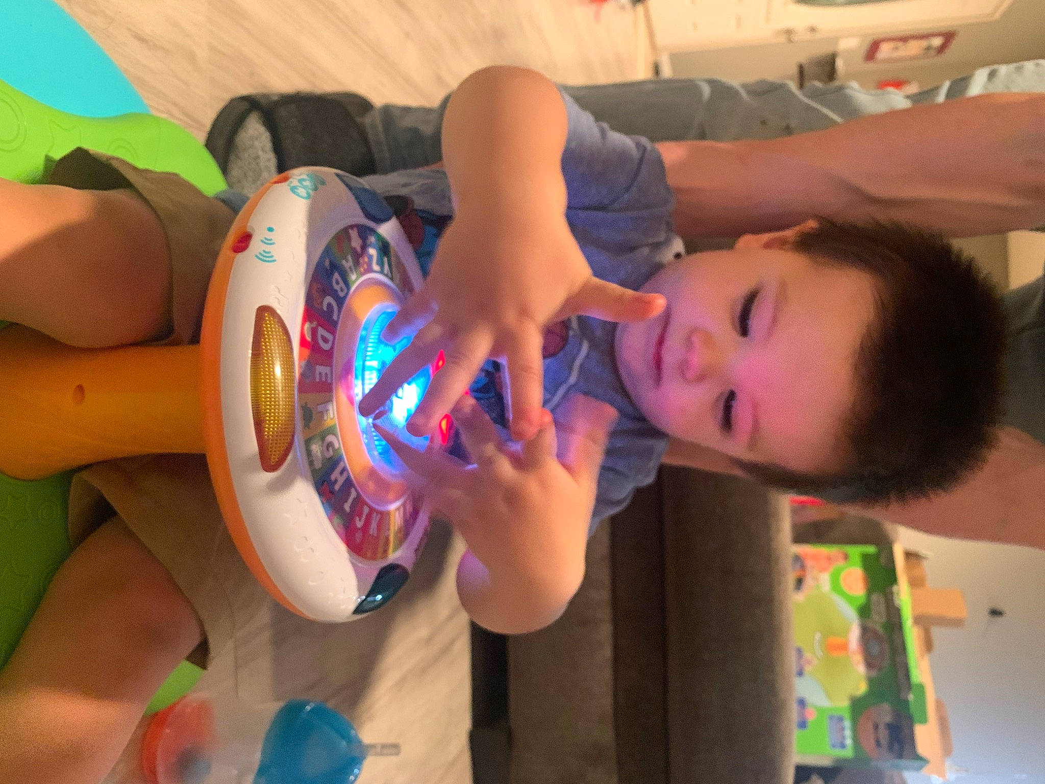 Kian is registered to the contest to win money with this photo: arm, beauty, child, drinkware, elbow, electric_blue, fun, gesture, happy, human_leg, leisure, nail, person, play, summer, t_shirt, thigh, thumb, toddler, water