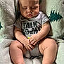 Cullen is registered to the contest to win money with this photo: baby, blanket, chair, child, clothing, cozy, cute, face, feet, hands, indoor, infant, legs, onesie, peaceful, pine_tree_pattern, portrait, resting, sleeping, soft_light