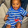 baby, child, smiling, striped_clothing, blue, red_crab, sitting, chair, happy, cute, infant, portrait, indoor, face, legs, feet, shorts, collar, buttoned_shirt, skin