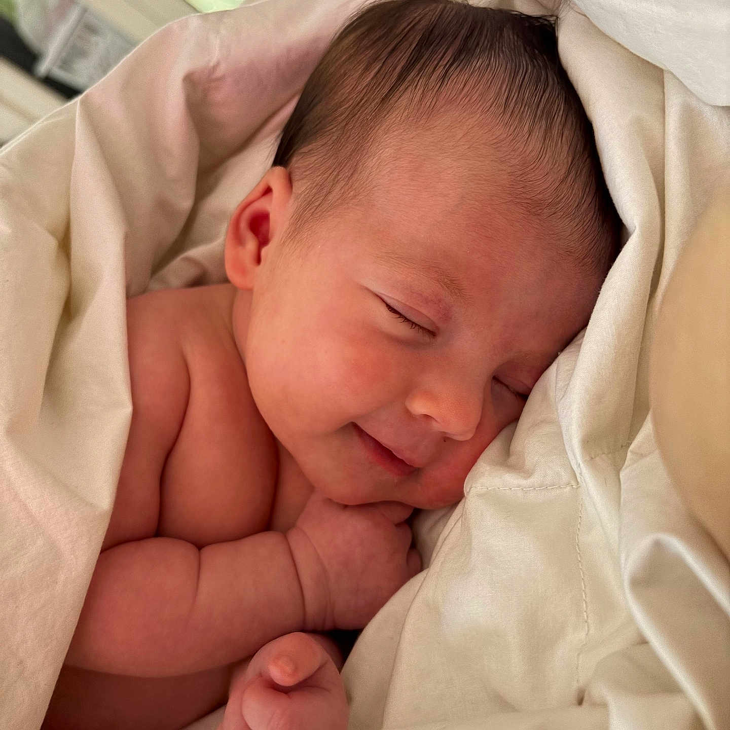Lyla joined the competition — help win amazing prizes! baby, sleeping, blanket, soft, newborn, peaceful, smile, skin, closeup, cute, infant, wrapped, warm, natural_light, resting, portrait, face, hands, cozy, bed