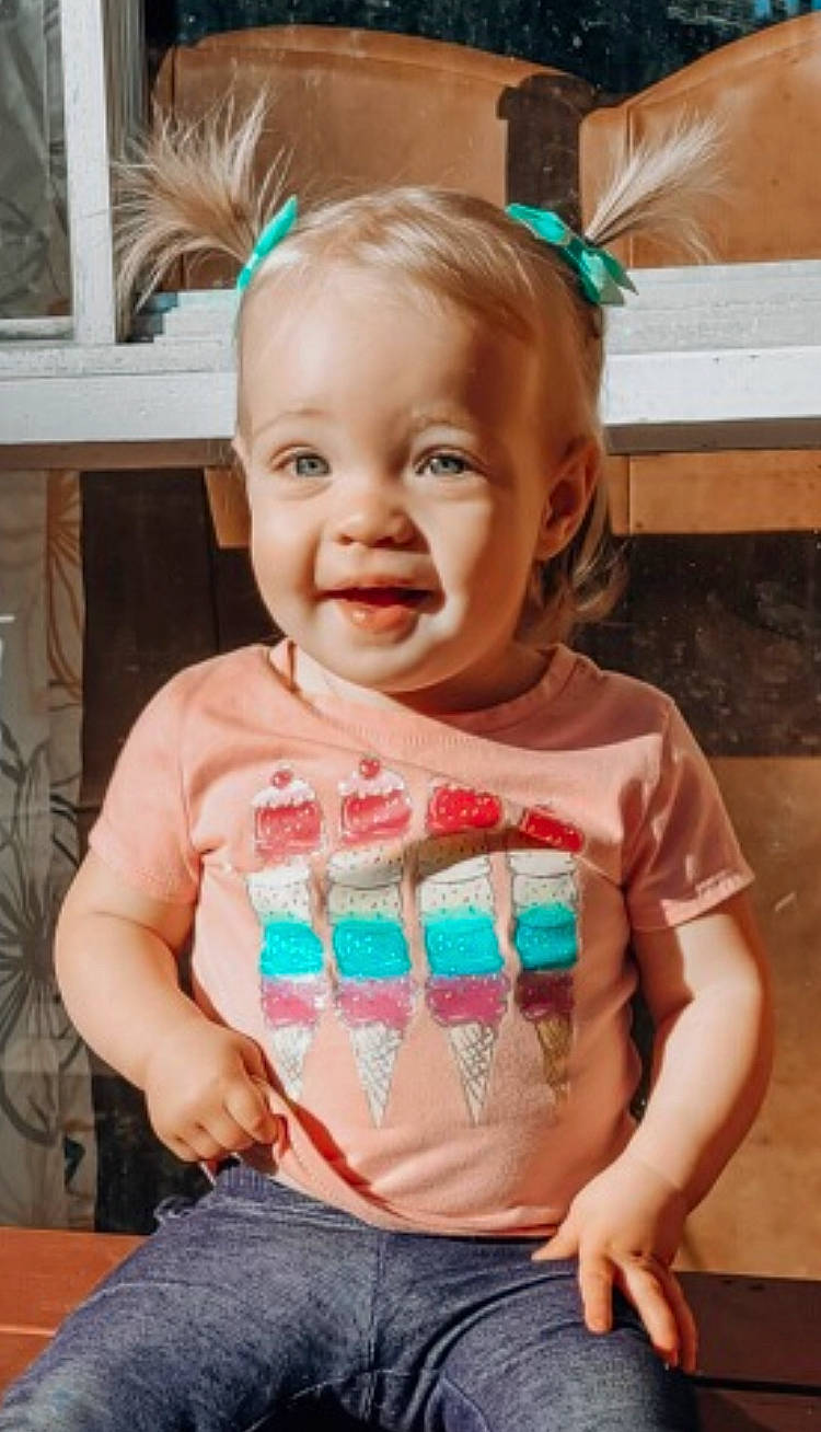 Adalyn is registered to the contest to win money with this photo: baby, baby_toddler_clothing, blue, cheek, child, fun, green, hair, happy, head, human_body, jeans, person, pink, skin, sleeve, smile, standing, summer, t_shirt