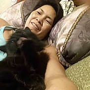 Baby Kat And Tebow joined the competition — help win amazing prizes! arm, bedroom, black_cat, blanket, cat, closeup, cozy, cuddle, fur, happy, head, home, indoor, person, pet, pillow, portrait, relaxing, selfie, smile