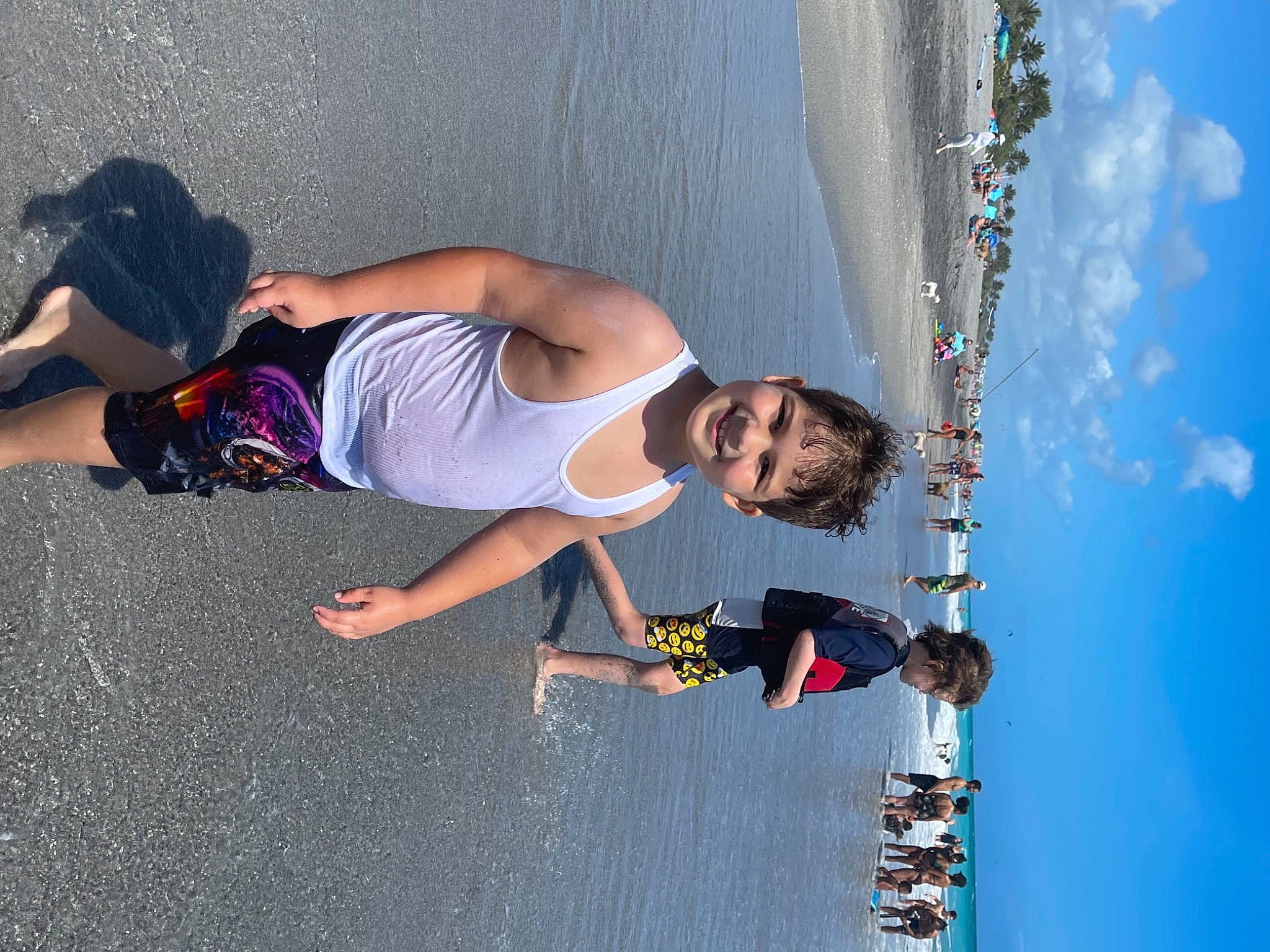 Anthony is registered to the contest to win money with this photo: adventure, blue, cloud, elbow, extreme_sport, fun, happy, human_leg, joy, knee, lake, leisure, person, recreation, shadow, shorts, sky, sunglasses, thigh, travel