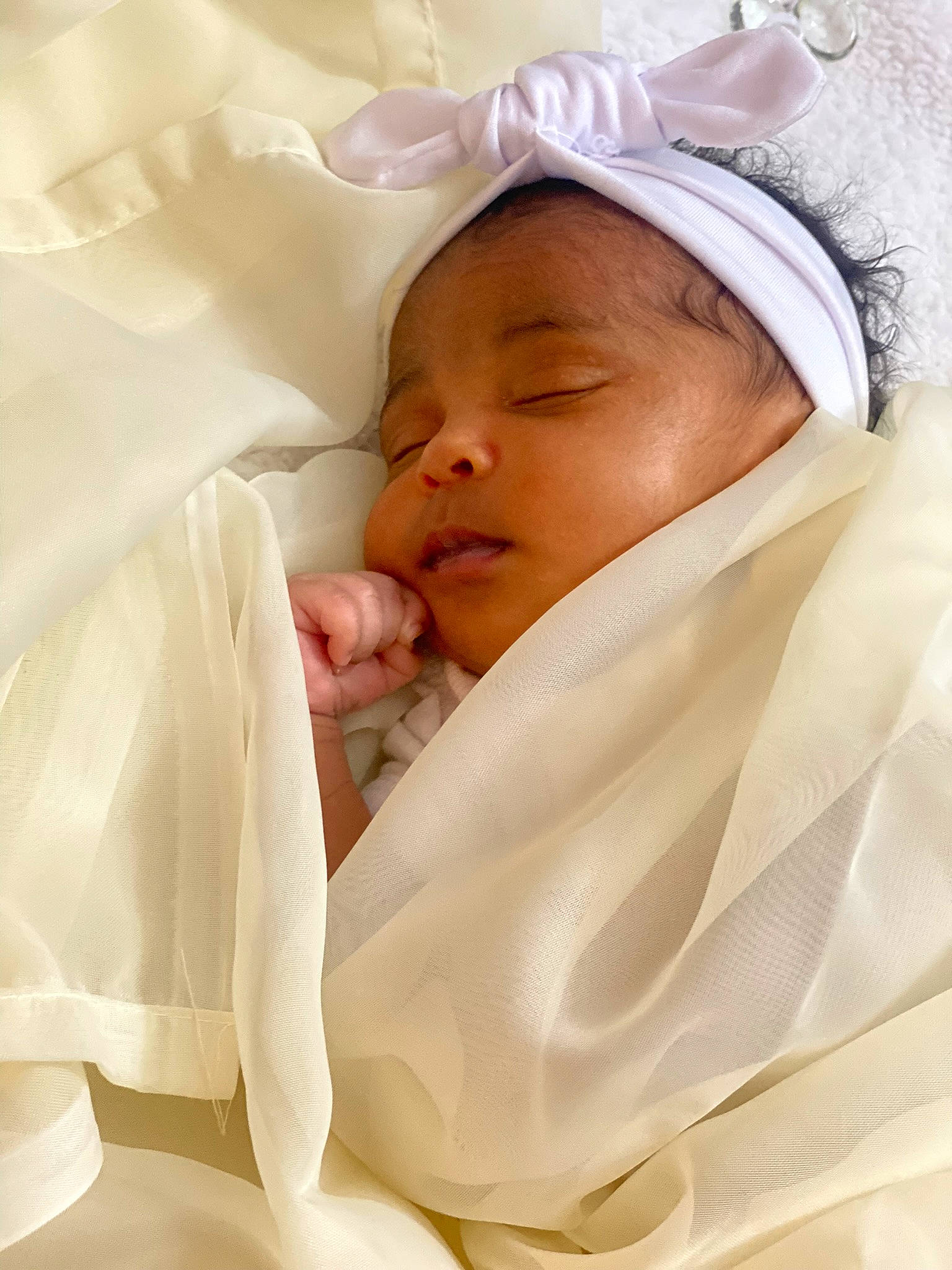 Amira is registered to the contest to win money with this photo: baby, baby_products, child, comfort, event, linens, peach, person, room, toddler