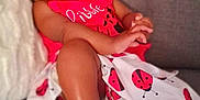 Summer is registered to the contest to win money with this photo: baby, child, infant, couch, clothing, headband, nike, sneakers, ladybug, red, white, black, smiling, happy, cute, indoor, fashion, footwear, person, portrait