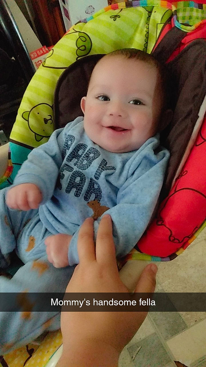 Christopher is registered to the contest to win money with this photo: baby, baby_carriage, baby_products, baby_toddler_clothing, cheek, child, comfort, finger, fun, happy, head, joy, lap, leg, pattern, person, sitting, skin, smile, thigh