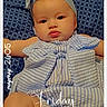 baby, infant, child, portrait, lying_down, headband, bow, striped_clothing, dress, cushion, blanket, bed, indoors, face, eyes, lips, arms, legs, patterned_background, text_overlay