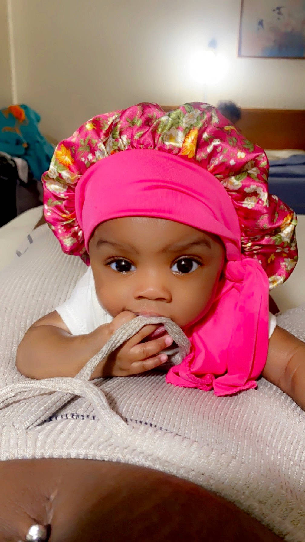 Amor joined the competition — help win amazing prizes! baby, baby_sleeping, baby_toddler_clothing, beanie, cap, cheek, child, comfort, fashion_accessory, fun, hair_accessory, happy, headwear, knit_cap, linens, magenta, person, pink, room, sitting