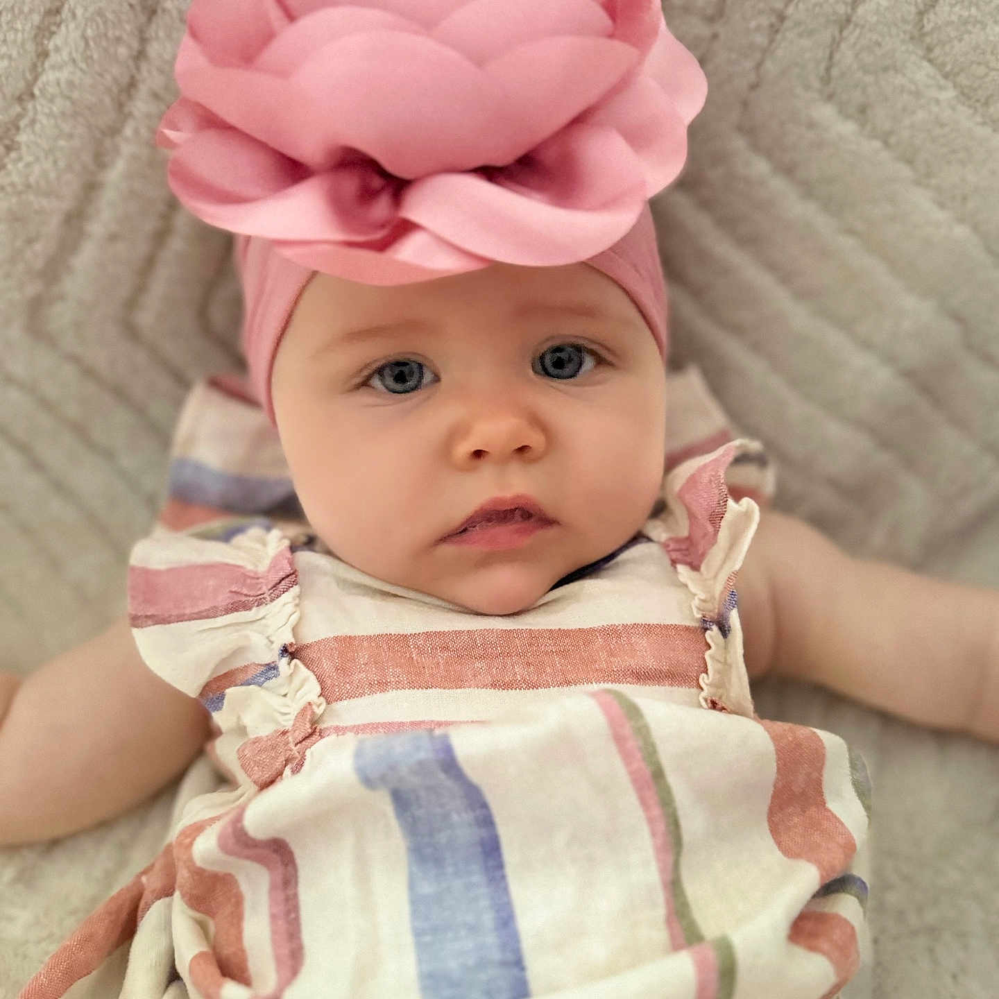 Harper is registered to the contest to win money with this photo: accessories, baby, blanket, bonnet, cap, clothing, cushion, face, flower, hat, head, headband, homedecor, newborn, person, photography, plant, portrait, rose, toy