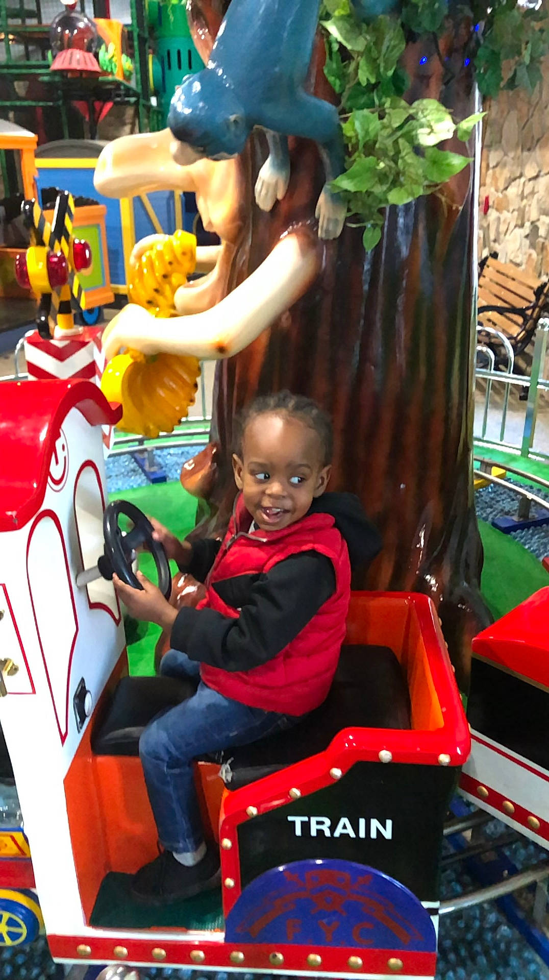 Amir is registered to the contest to win money with this photo: automotive_design, baseball_cap, chair, child, event, fictional_character, fun, games, green, happy, leisure, motor_vehicle, people, person, play, public_space, recreation, snapshot, t_shirt, toddler