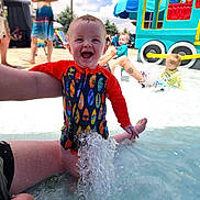 Holden joined the competition — help win amazing prizes! toddler, child, swimsuit, water, splash, pool, playground, summer, outdoor, happy, water_park, people, adult, sunny, fun, colorful, toy_train, blue_sky, swimming, play