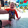 toddler, child, swimsuit, water, splash, pool, playground, summer, outdoor, happy, water_park, people, adult, sunny, fun, colorful, toy_train, blue_sky, swimming, play