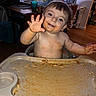 toddler, child, messy, high_chair, spaghetti, food, face, blue_eyes, indoor, dining_room, wood_floor, table, chair, globe, person, smiling, hand, hair, plate, baby