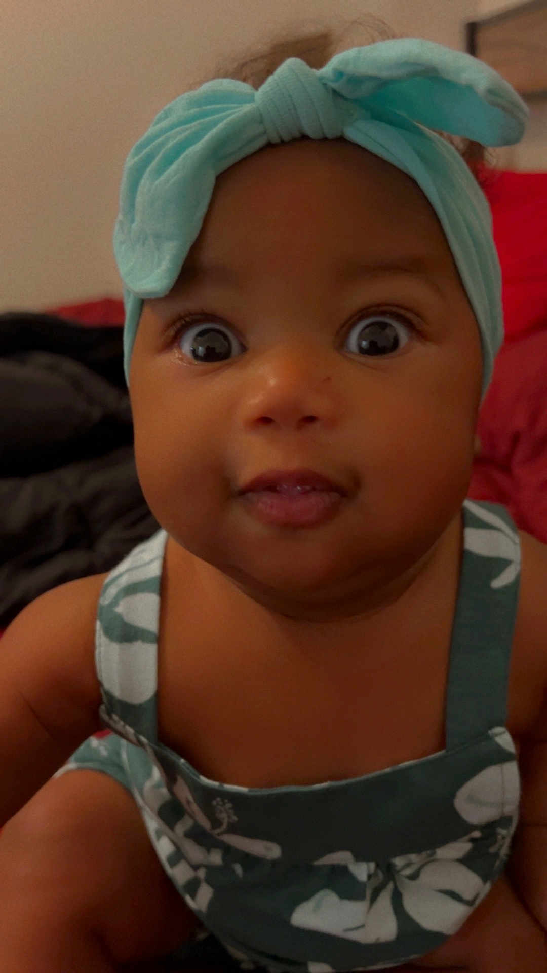 Symora is registered to the contest to win money with this photo: accessories, baby, bodypart, bonnet, cap, clothing, couch, dress, face, finger, formalwear, furniture, hand, hat, head, headband, newborn, person, photography, portrait