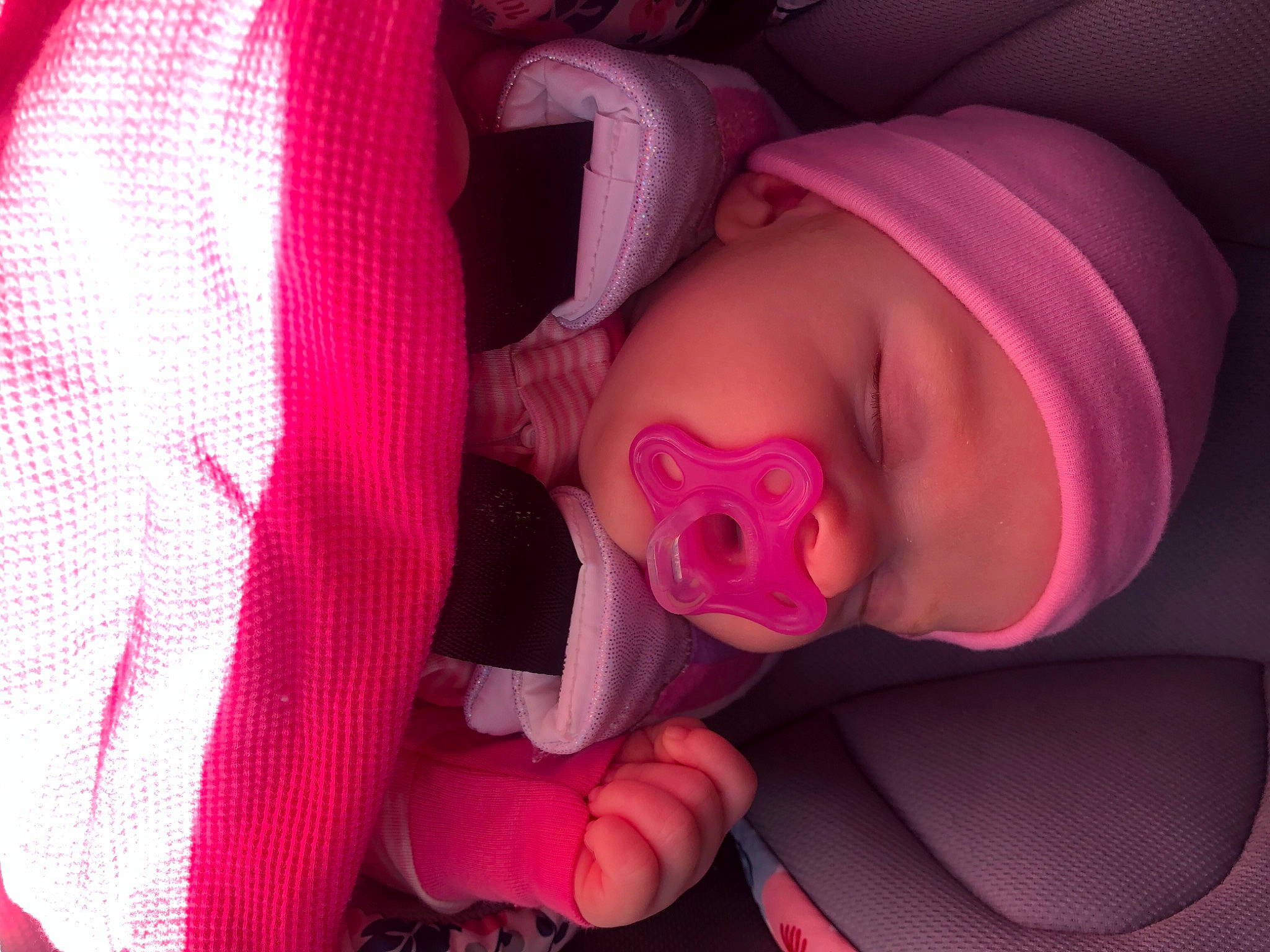 Brinleigh is registered to the contest to win money with this photo: baby, comfort, ear, finger, headgear, headwear, helmet, lip, mammal, mouth, nose, organ, person, pink, plant, product, purple, skin, textile, toddler