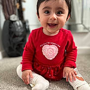Natalia joined the competition — help win amazing prizes! baby, child, smiling, red_dress, heart, sitting, carpet, indoors, cute, happy, face, person, young_child, long_sleeve, white_tights, footwear, portrait, front_view, small_person, bright