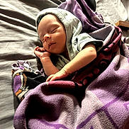 Deidara joined the competition — help win amazing prizes! baby, sleeping, blanket, bed, purple, hoodie, controller, game_controller, infant, resting, cozy, soft, child, peaceful, portrait, indoor, fabric, cute, tiny, relaxation