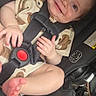 Lyric is registered to the contest to win money with this photo: baby, child, infant, smiling, happy, car_seat, harness, buckle, red_button, sitting, portrait, close_up, indoor, vehicle, automotive, baby_clothing, bare_feet, hands, toes,  안전