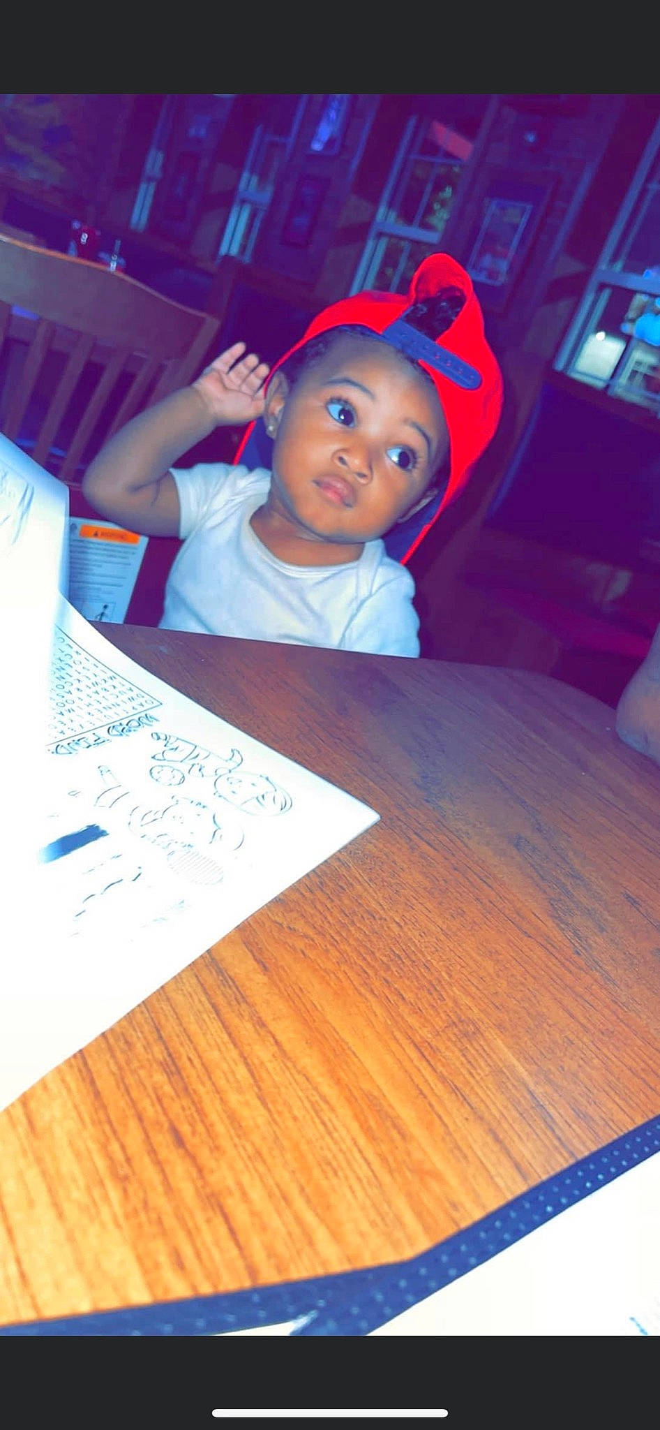 Arshawn is registered to the contest to win money with this photo: baby, blue, chair, child, design, desk, electric_blue, flooring, fun, furniture, hardwood, lighting, person, room, snapshot, space, t_shirt, table, toddler, wood