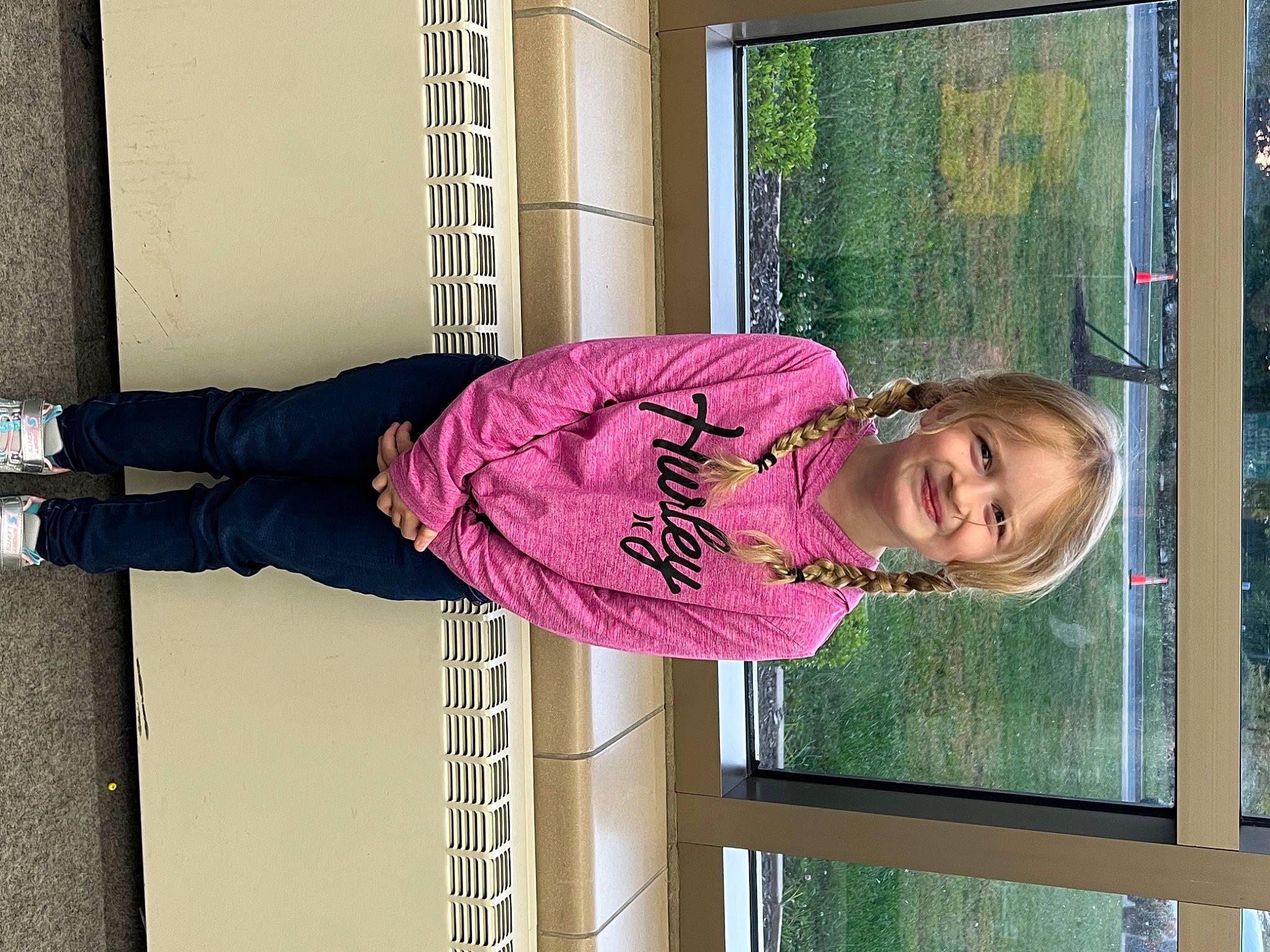 Destiny is registered to the contest to win money with this photo: baby_toddler_clothing, child, fun, happy, house, human_leg, joy, knee, leisure, magenta, pattern, person, pink, plant, purple, smile, sock, standing, thigh, toddler