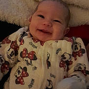 Eva joined the competition — help win amazing prizes! baby, infant, smiling, onesie, minnie_mouse, blanket, cozy, cute, clothing, child, portrait, face, happy, indoor, soft, warm, person, apparel, sleepwear, newborn