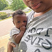 Zymire joined the competition — help win amazing prizes! child, baby, person, adult, outdoor, street, tree, house, curly_hair, holding, hand, face, tshirt, piercing, skin, daylight, suburb, calm, closeup, portrait