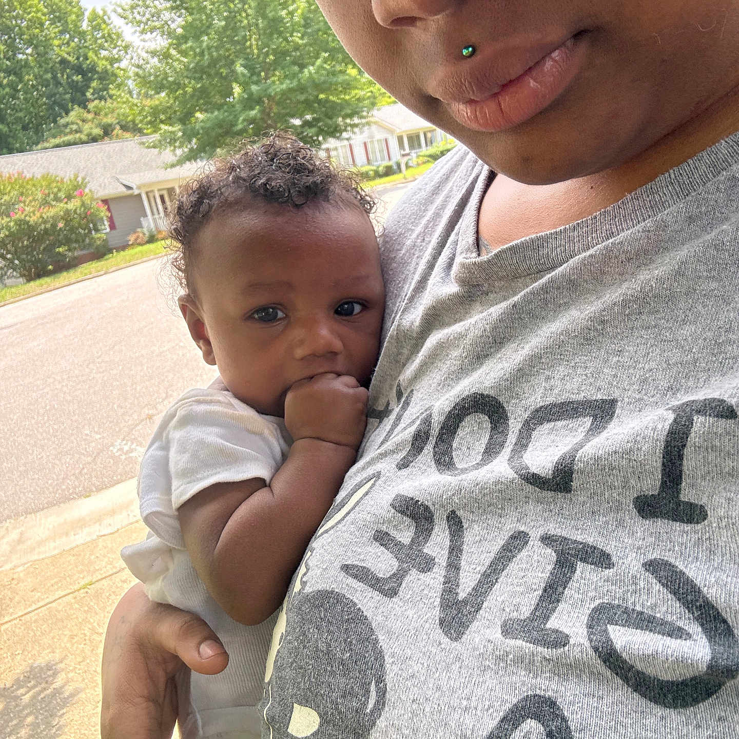 Zymire joined the competition — help win amazing prizes! child, baby, person, adult, outdoor, street, tree, house, curly_hair, holding, hand, face, tshirt, piercing, skin, daylight, suburb, calm, closeup, portrait