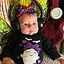 Paisley joined the competition — help win amazing prizes! baby, headphones, bow, purple, halloween, ghost, bats, black_clothing, blanket, drool, cute, infant, lying_down, colorful, headband, face, expression, clothing, person, indoors