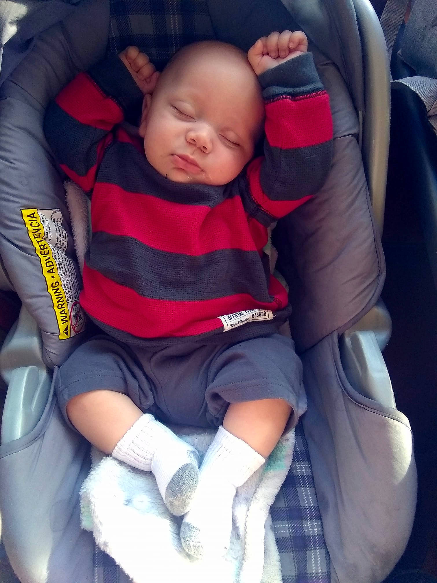 Adrian is registered to the contest to win money with this photo: auto_part, baby, baby_carriage, baby_in_car_seat, baby_products, car_seat, car_seat_cover, child, comfort, person, product, seat_belt, sleep, toddler