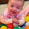 Scarlett Hopkins joined the competition — help win amazing prizes! baby, smiling, happy, child, colorful_balls, play_area, pink_bib, cute, infant, portrait, indoors, soft_lighting, hands, face, joyful, toddler, playful, closeup, skin, young_child