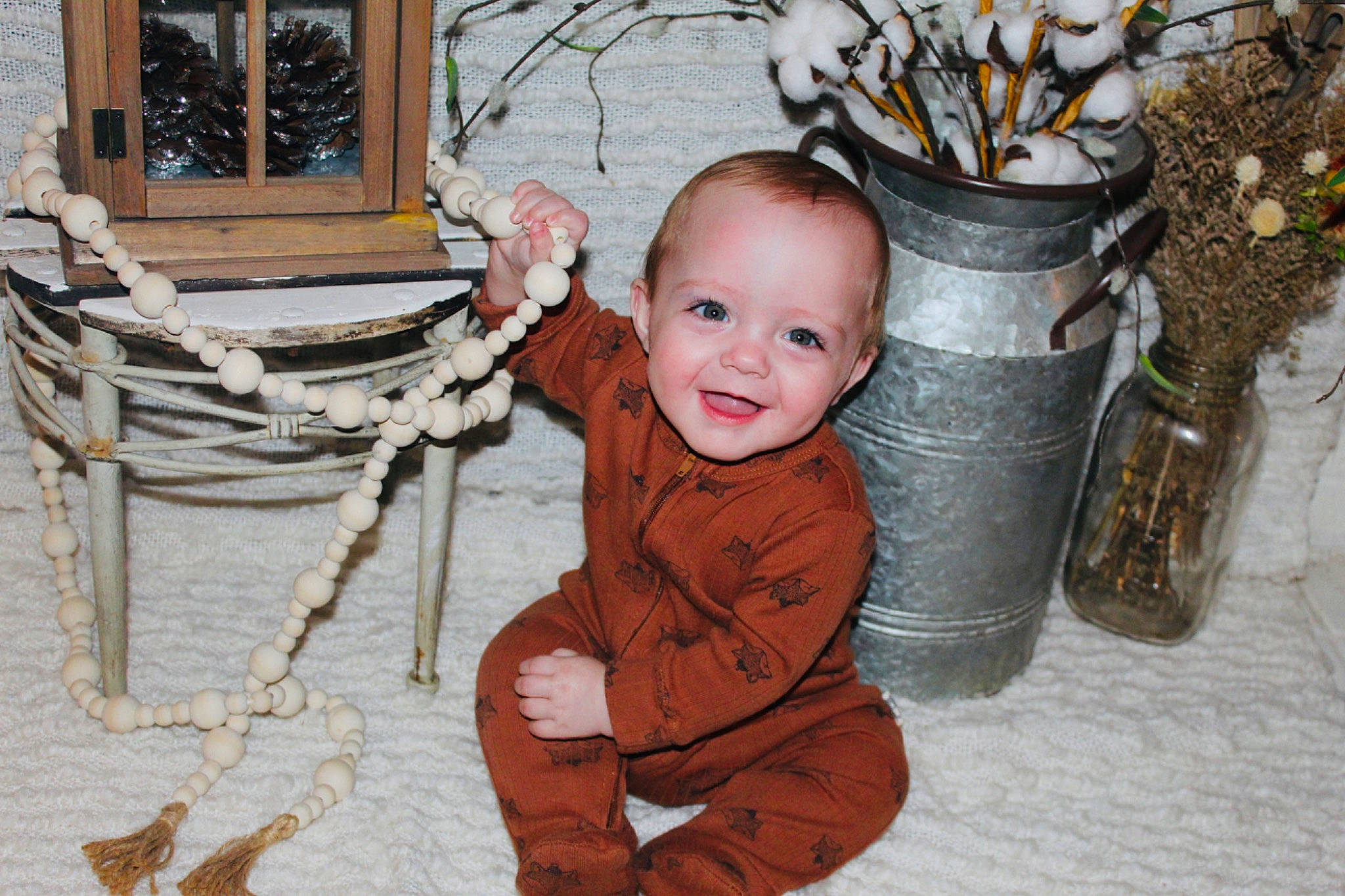 Myles is registered to the contest to win money with this photo: baby, baby_toddler_clothing, cheek, child, coffee_cup, cup, drinkware, eye, flowerpot, fun, happy, head, joy, leaf, person, serveware, sitting, smile, toddler, twig