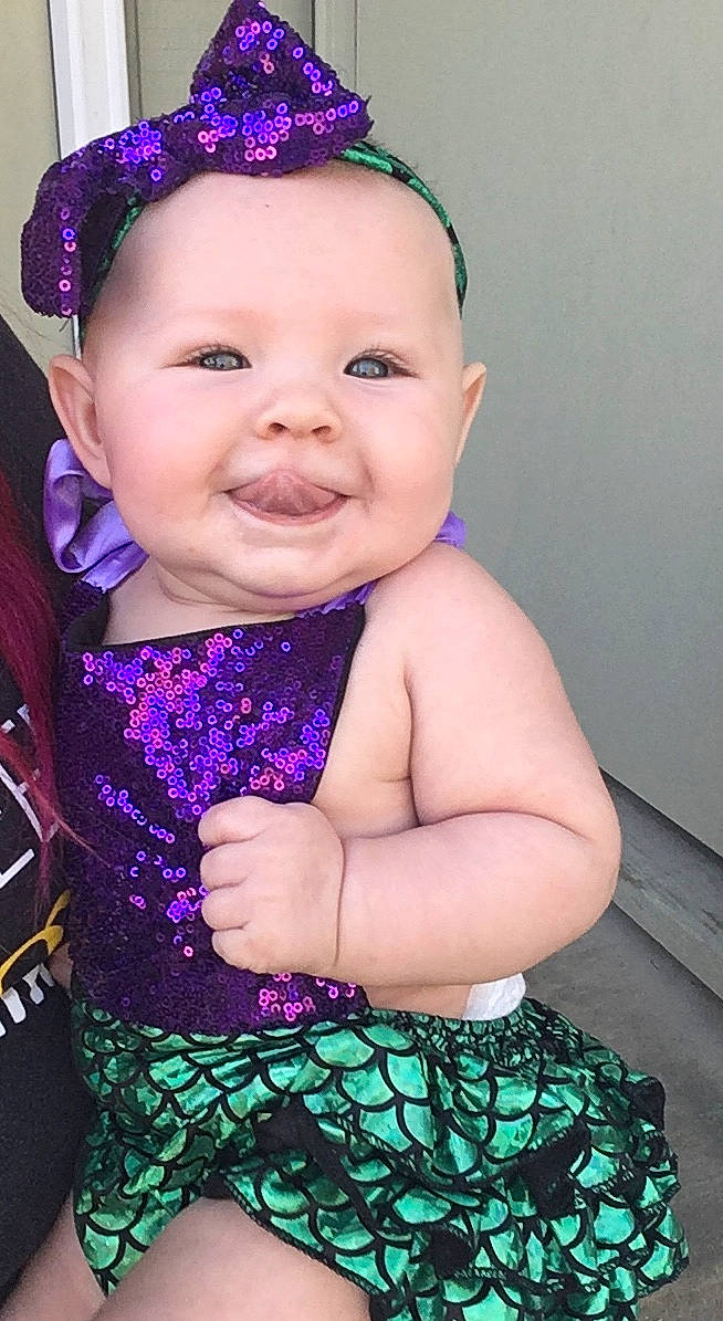 November joined the competition — help win amazing prizes! baby, baby_products, baby_toddler_clothing, cheek, child, child_model, dress, face, fashion_accessory, hair_accessory, head, headband, headgear, joy, pattern, person, pink, product, purple, skin