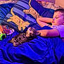 Babybell is registered to the contest to win money with this photo: bed, blanket, boy, cat, child, cozy, cute, home, indoor, minecraft, naptime, peaceful, pet, pillow, purple_light, resting, sleeping, soft_light, tabby_cat, toy