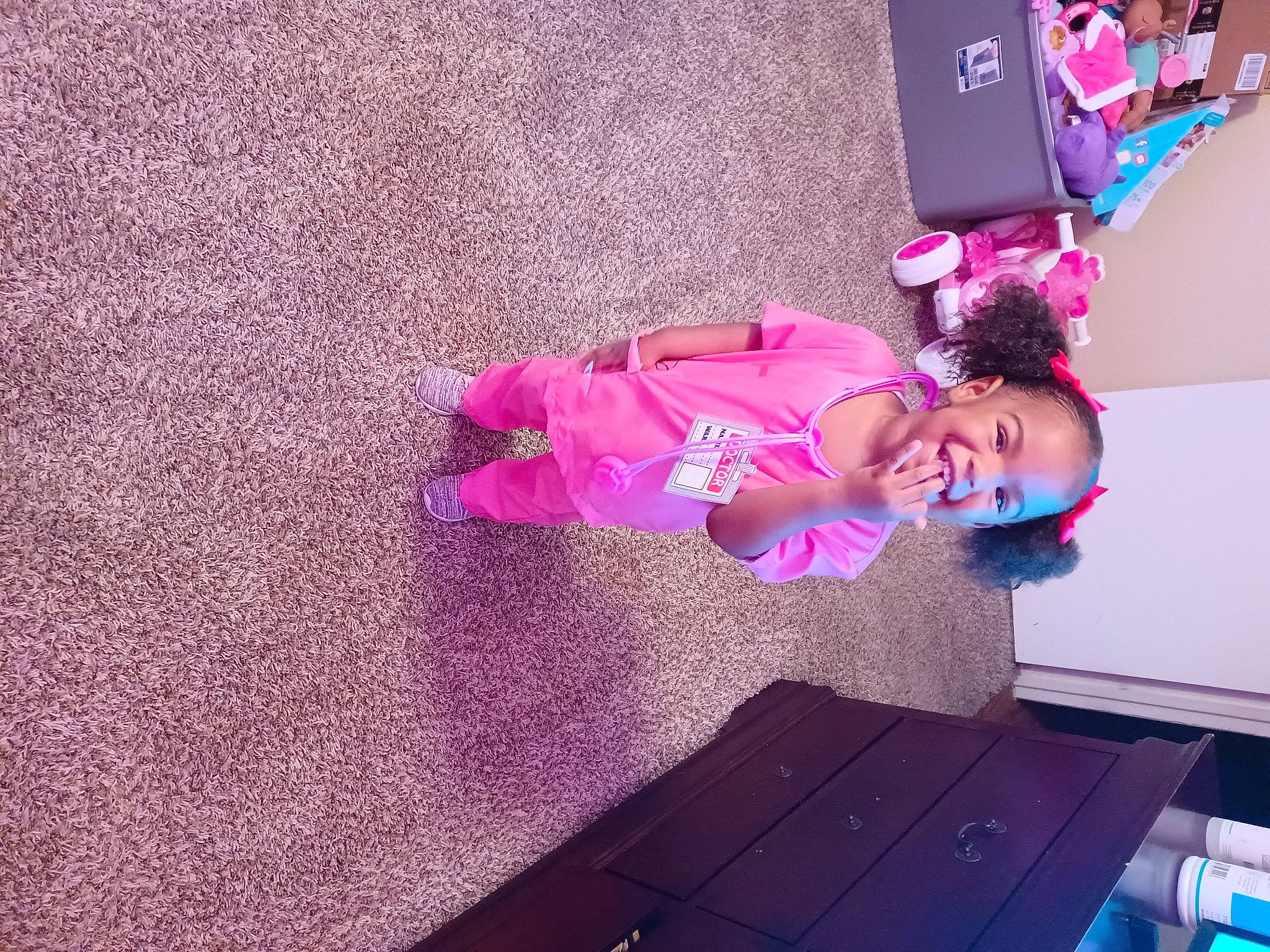 Sariyah joined the competition — help win amazing prizes! baby_toddler_clothing, child, dress, floor, flooring, fun, happy, hardwood, joy, leisure, magenta, person, pink, plant, play, purple, room, smile, toddler, tree