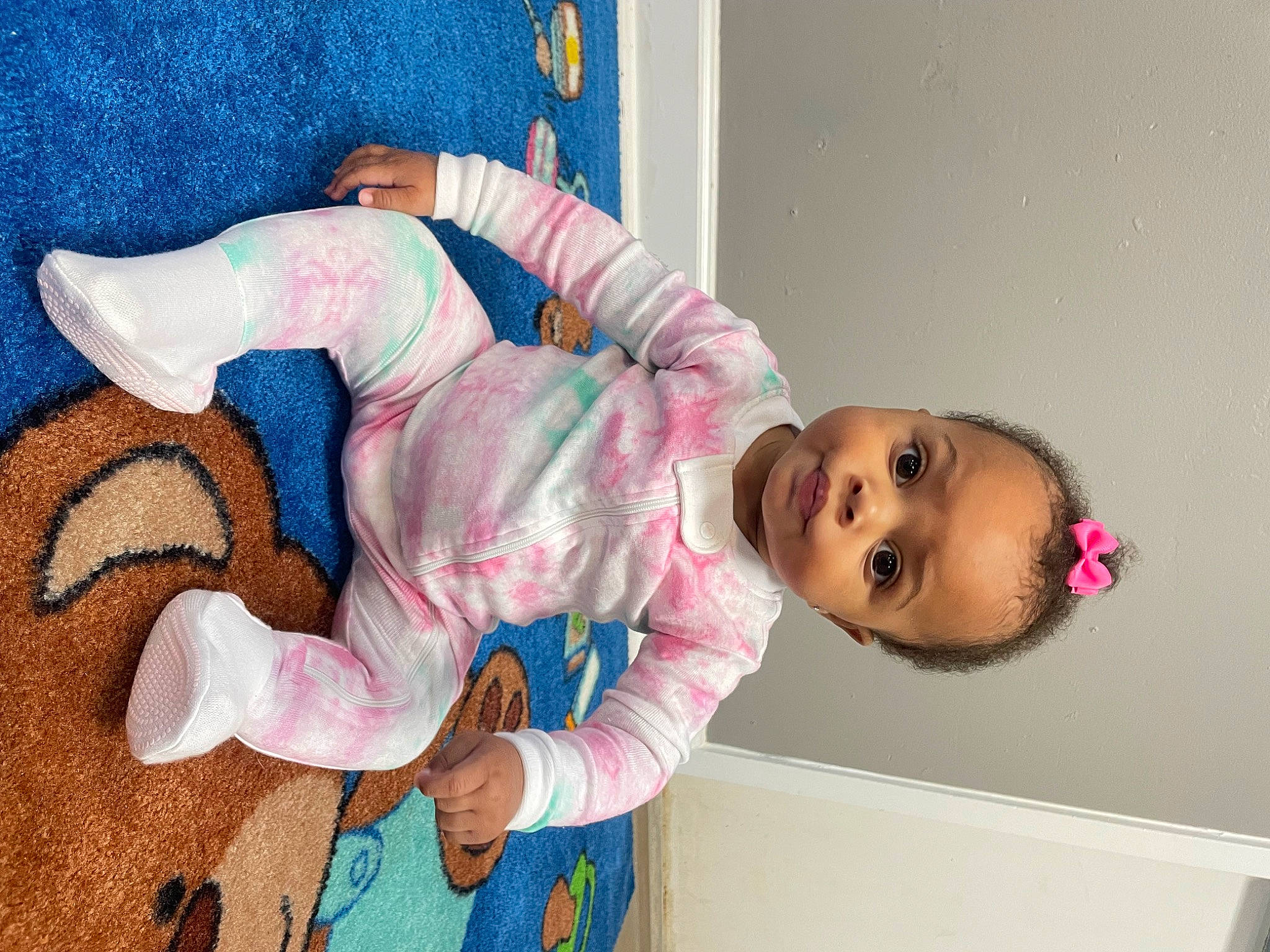 Tynita is registered to the contest to win money with this photo: arm, baby, baby_products, baby_toddler_clothing, cheek, child, comfort, fun, happy, linens, mouth, nose, person, pink, room, smile, toddler