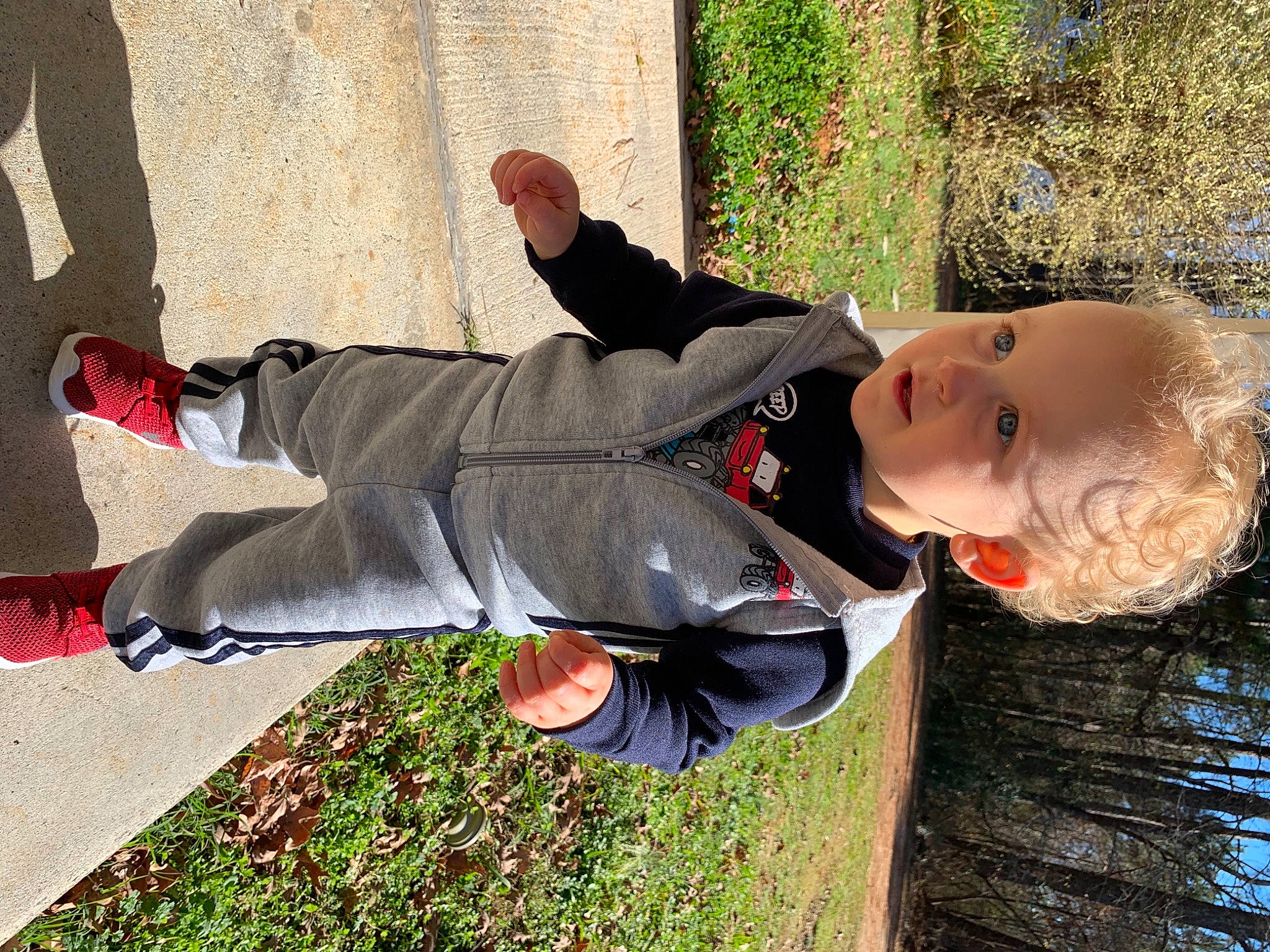 Cooper joined the competition — help win amazing prizes! active_pants, fun, grass, happy, human_leg, jacket, knee, leisure, outdoor_shoe, people_in_nature, person, plant, shoe, sitting, smile, sneakers, street_fashion, thigh, tree, walking_shoe