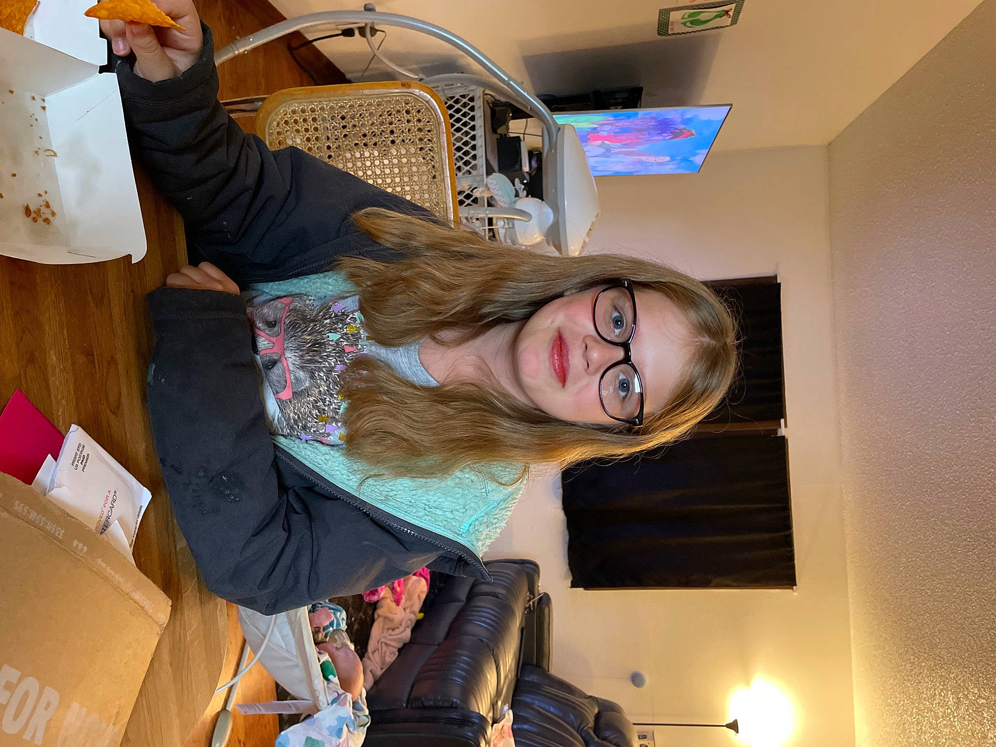 Bailey is registered to the contest to win money with this photo: art, box, cardboard, carton, ceiling, employment, eyewear, fashion_design, fun, hair_coloring, person, room, shipping_box, smile, vision_care, visual_arts, wood