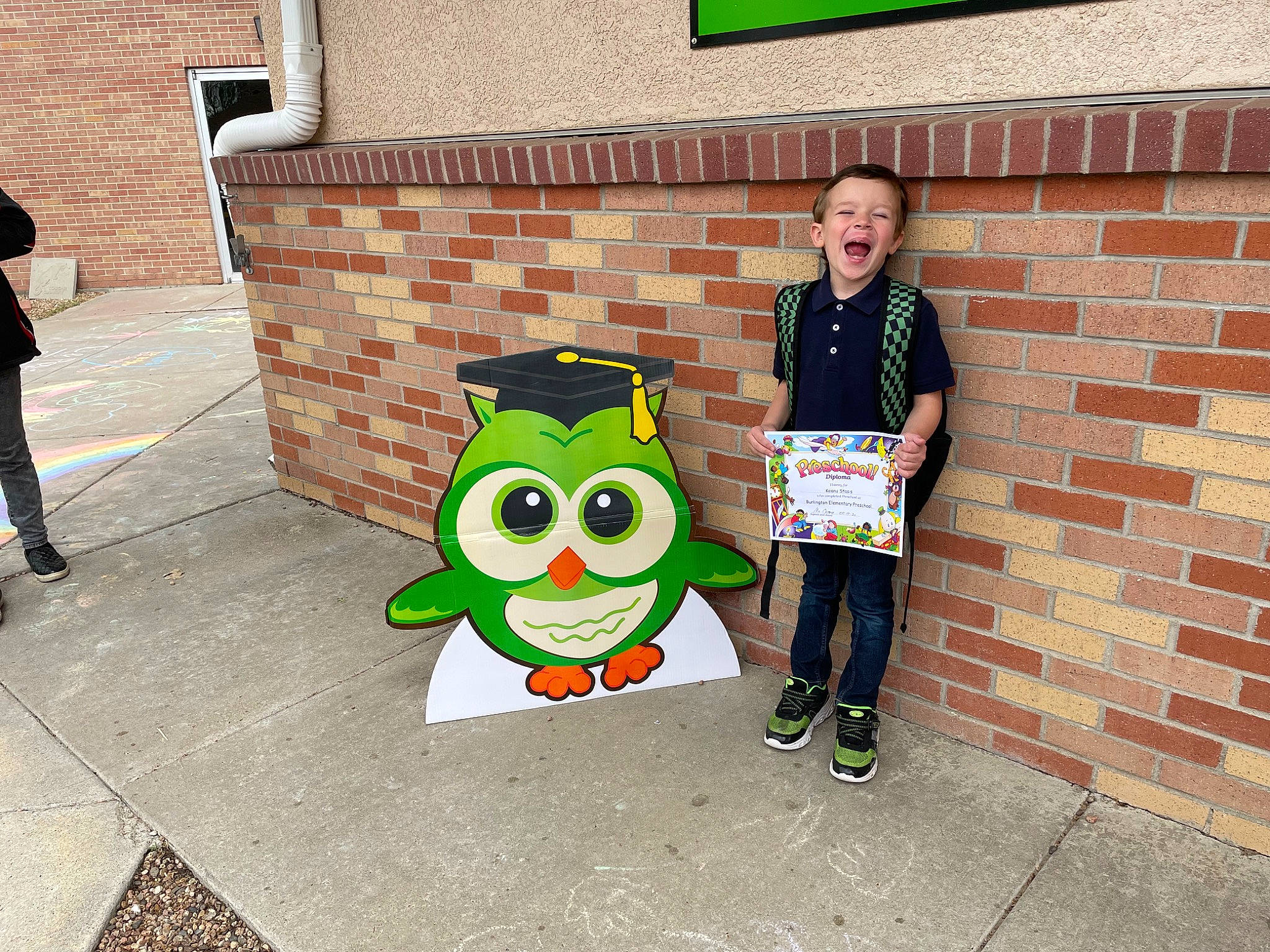 Keanu is registered to the contest to win money with this photo: asphalt, brick, brickwork, city, community, flooring, fun, grass, green, human, human_settlement, leaf, leisure, person, plant, public_space, recreation, road, sidewalk, sitting