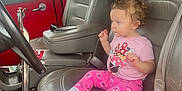 Ariel joined the competition — help win amazing prizes! toddler, child, car_seat, leather_seat, pink_clothing, minnie_mouse, socks, curly_hair, vintage_car, steering_wheel, seatbelt, window, red_interior, gray_seat, floor_mat, car_door, interior, side_view, person, casual