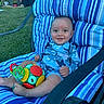 baby, child, smiling, toys, chair, cushion, blue_stripes, outdoor, grass, woman, garden, furniture, person, happy, playing, summer, casual_clothing, relaxing, daytime, seat