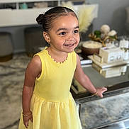 Amelia is registered to the contest to win money with this photo: child, clothing, computerhardware, dress, electronics, eveningdress, face, female, formalwear, girl, happy, hardware, head, monitor, person, photography, portrait, screen, smile, tv